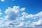 Whimsical clouds blue sky background featuring soft, dreamy cloud formations