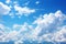 Whimsical clouds blue sky background featuring soft, dreamy cloud formations