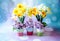 Whimsical cups of spring flowers with yellow daffodils