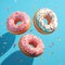 Whimsical delight pink donuts with colorful sprinkles on blue background