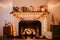 a whimsical fireplace with holiday lights, ornaments, and miniature gifts