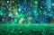 Whimsical party backdrop with green-blue bokeh, falling snow, and glittering sparkles
