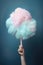 Whimsical Pastel Cloud in Hand: A Dreamy Cotton Candy Creation. Generative AI