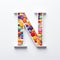 Whimsical Pill Art: Vibrant Letter M Sculpture With Colorful Pills