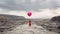 Whimsical Woman In Red Outfit With Balloon In Desert Landscape