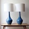 Whiplash Curves Mid-century Modern Blue Vase Lamps On Wooden Table