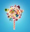 Whipped chantilly cream lolipop concept. Round whipped milk shake cream like lollipop with candy, sweets and candy on