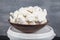 Whipped Cream with Butter. close up of a white whipped or sour cream in bowl. Vanilla whipped cream