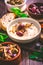 Whipped feta cheese dip with garlic, olives, lemon and caramelized onions