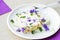 Whipped gelatin cream with vegetable and blooming flower