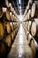 Whiskey, bourbon, scotch or wine barrels in an aging facility.