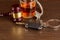 Whiskey with car keys and handcuffs. Concept for drinking and driving