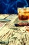 Whiskey, cigar and cards on a wooden background