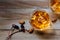 Whiskey drinks with ice on wooden background