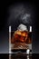 Whiskey with ice and smoke