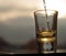 Whiskey pouring into shot glass