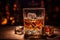 Whiskey on the rocks. crystal clear glass with glistening ice cubes and rich amber hue