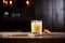 whiskey sour against dark wood, warm ambient lighting