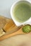 Whisking green Japanese Matcha powder in chawan with chasen