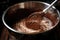 whisking hot chocolate mixture in a saucepan