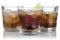 Whisky, alcohol and cola with ice cubes