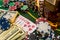 Whisky glass bottle with poker chip, dollars on the green table, the glare of light as gambling game