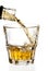 Whisky pouring in glass, isolated, clipping path