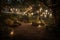 whispering garden, with lanterns and string lights creating a magical atmosphere