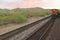 Whistle Stop Kerry Express across America train moving through landscape, American Southwest