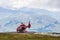 WHISTLER, CANADA - AUGUST 25, 2019: red helicopter on Blackcomb mountain for air lookup tour