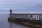 Whitby harbour entrance, east pier and beacon, Yorkshire, UK.