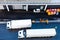 White 10 ten wheeler freight truck parked next to 18 eighteen wheeler delivery trailer