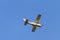A white 1977 CESSNA 210M Fixed wing single engine private propeller airplane flying in clear sky