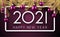 White 2021 sign on lilac background