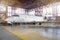 White aircraft in the hangar on a large-scale inspection, repair.