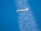 White airplane in blue sky