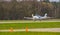 White airplane landing, recreational air transportation, aircraft landing at the airport