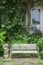 White alloy bench in outdoor garden