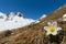 White alpine anemone pulsatilla alpina in bloom with snowcapped mountains