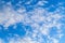 White altocumulus clouds layer in a blue sky at daytime