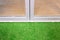 White aluminium door and grass floor decoration