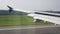 White american plane is landing in India airport in summer day.