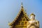 White angel act paying respect at the entrance gate to welcome in the public Buddhist temple. Thai style golden angel is acting Wa