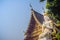 White angel act paying respect at the entrance gate to welcome in the public Buddhist temple. Thai style golden angel is acting Wa