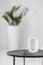 White aroma diffuser on black table in room