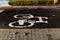 White arrow and bycicle sign on lanes road. Bycicle road