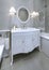 White art deco styled sink console in bathroom