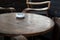 White ashtray on wooden table