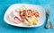 White asparagus with tomatoes and ham