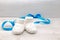 White baby shoes with blue young stars and blue ribbon on the ba